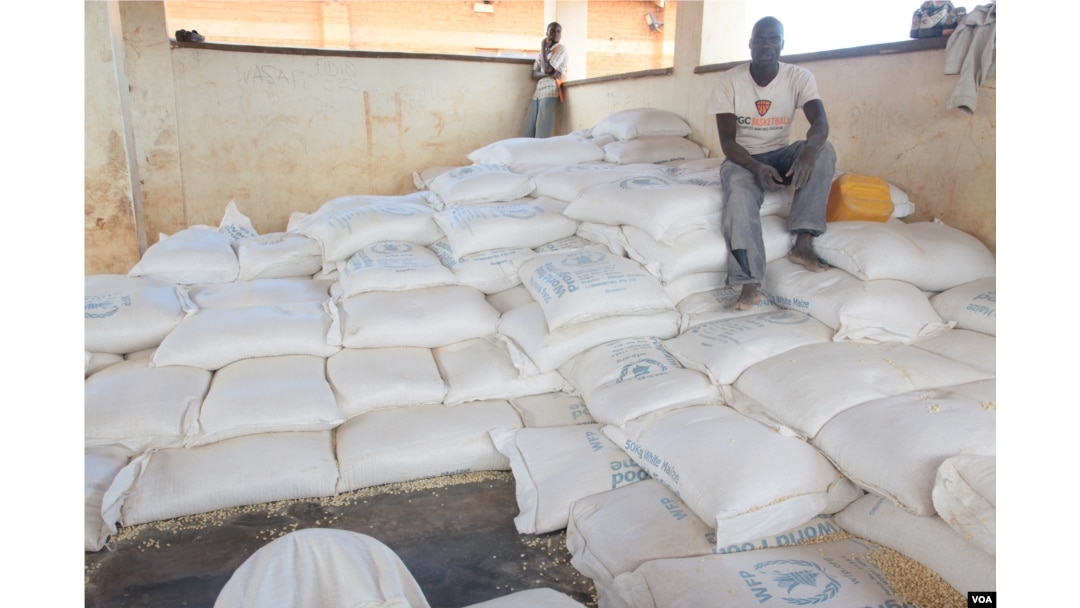 Bags of maize ready for distribution at Dzaleka refugee camp in Malawi (photo taken by Lameck Masina).