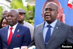 FILE - Felix Tshisekedi (R), leader of Congolese main opposition, the Union for Democracy and Social Progress (UDPS) party, flanked by Vital Kamerhe, leader of the (UNC) party, address a news conference in Nairobi, Kenya, Nov. 23, 2018.