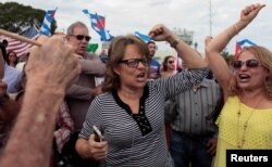 People celebrate after the announcement of the death of Cuban revolutionary leader Fidel Castro in the Little Havana district of Miami, Fla., Nov. 26, 2016.