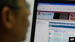 Ma Ngok, an associate professor in the Department of Government and Public Administration at the Chinese University of Hong Kong browses his webmail at the university in Hong Kong, June 13, 2013.