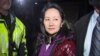 FILE - This TV image shows Huawei Technologies Chief Financial Officer Meng Wanzhou as she exits the court registry following the bail hearing at British Columbia Superior Courts in Vancouver, British Columbia, Dec. 11, 2018.