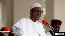 FILE - Nigerian President Muhammadu Buhari speaks at the presidential villa in Abuja, Nigeria. The state rolled out an online recruitment tool, N-Power, this month and said it will hire half a million university graduates to work across the country in various sectors.