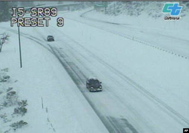 This image from a Caltrans traffic camera shows snow on the Interstate 5 and Highway 89 junction near Mt. Shasta, Calif., Wednesday, Feb. 13, 2019.