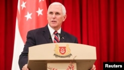 U.S. Vice President Mike Pence speaks at a joint press conference at the Istana, or Presidential Palace, in Singapore, Nov. 16, 2018. 