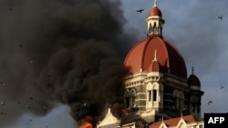 Flames gush from Taj Mahal Palace hotel during a terror attack that claimed 166 in Mumbai, Nov. 27, 2008.
