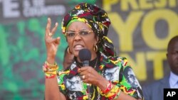 FILE - Zimbabwe's first lady, Grace Mugabe, addresses party supporters at a ZANU PF Rally in Chinhoyi in this July 29, 2017 