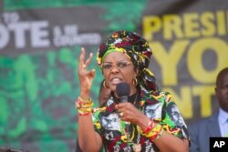 FILE - Zimbabwe's first lady, Grace Mugabe, addresses party supporters at a ZANU PF Rally in Chinhoyi in this July 29, 2017