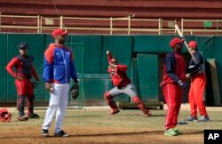 Members of Cuba's national baseball team take part in a training session in San Jose de las Lajas, Mayabeque province, Cuba, March 17, 2016.