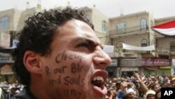 An anti-government protester shouts slogans during a rally demanding the ouster of Yemen's President Ali Abdullah Saleh in Sana'a, March 19, 2011