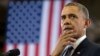 President Barack Obama pauses as he speaks at McGavock High School, Jan. 30, 2014, in Nashville, Tennessee.