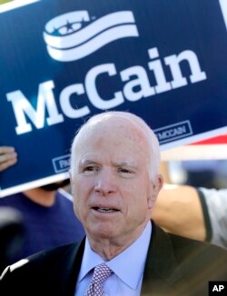 FILE - U.S. Sen. John McCain, R-Ariz., speaks outside a polling station after voting, Aug. 30, 2016, in Phoenix.
