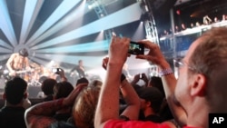 Mark Vopel records Jane's Addiction performance on the LG Thrill 4G, a glasses free 3D smartphone, at the 3D User-Generated Concert, July 25, 2011 in New York.