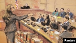 Assistant U.S. Attorney Andrea Goldbarg points at Mexican drug lord Joaquin "El Chapo" Guzman, back row center, in this courtroom sketch during Guzman's trial in Brooklyn federal court in New York City, Jan. 30, 2019. 