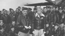 Lt. Col. Jimmy Doolittle accepts a medal from the skipper of the USS Hornet, Capt. Marc A. Mitscher.