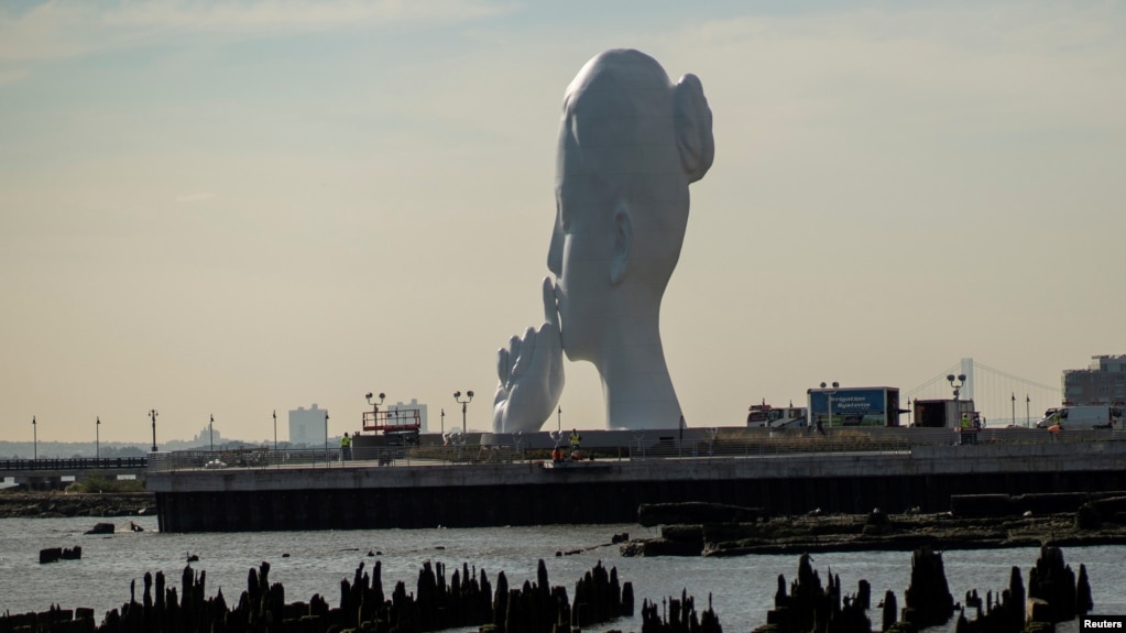The statue "Water's Soul" by the artist Jaume Plensa is seen in Jersey City, New Jersey, U.S., October 14, 2021. (REUTERS/Eduardo Munoz)
