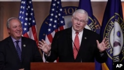 Republican team manager Rep. Joe Barton, R-Texas, right, accompanied by Democrat team manager Rep. Mike Doyle, D-Pa., speaks during a news conference on Capitol Hill in Washington, June 14, 2017.