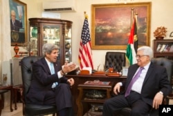 FILE - U.S. Secretary of State John Kerry, left, meets with Palestinian President Mahmoud Abbas in Amman, Jordan on Saturday, June 29, 2013, after shuttling to Jordan from Jerusalem in the morning.