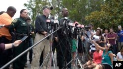 Nick Wiley, executive director of the Florida Fish & Wildlife Conservation Commission, left, and Orange County Sheriff Jerry Demings answer questions from reporters during a news conference in Lake Buena Vista, Florida, June 15, 2016. 