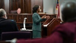 FILE - Prosecutor Larissa Ollivierre questions a potential juror during jury selection in the trial of the men charged with killing Ahmaud Arbery at the Glynn County Superior Court, Oct. 26, 2021, in Brunswick, Ga.