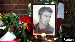 Tributes are seen outside the house of singer George Michael, in Goring, southern England, Britain December 26, 2016.