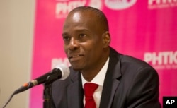 FILE - Presidential candidate Jovenel Moise, from the PHTK political party, gives a press conference in Port-au-Prince, Haiti, Oct. 19, 2015.