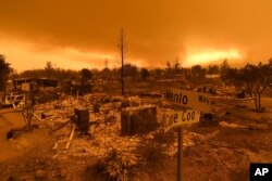 Homes leveled by the Carr Fire line the Lake Keswick Estates area of Redding, Calif., July 27, 2018.