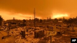 Homes leveled by the Carr Fire line the Lake Keswick Estates area of Redding, Calif., July 27, 2018.