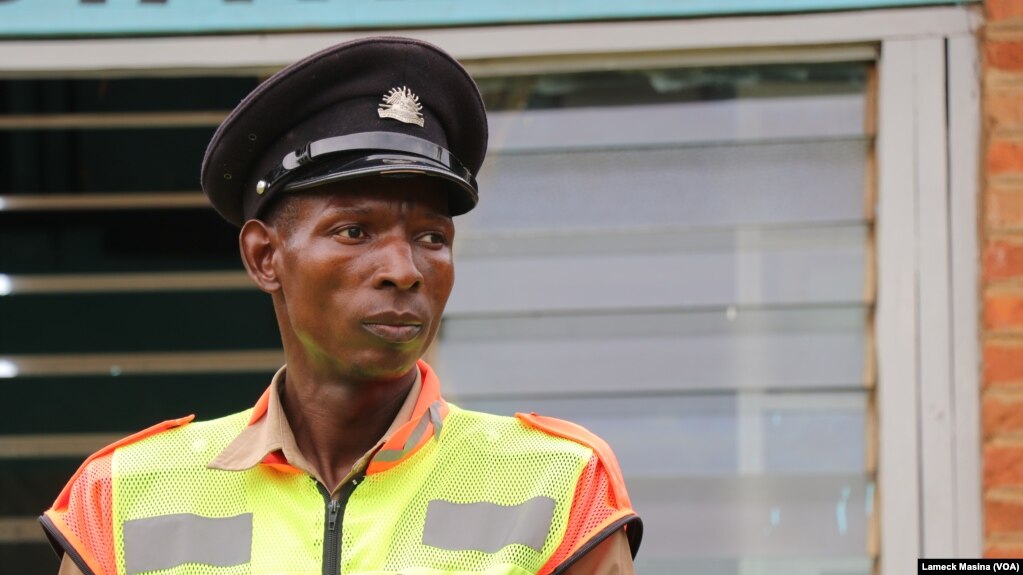 Kanduwa Sande is a police officer with a greater passion for sports. (Lameck Masina/VOA)