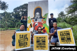 Warga Santan, Kutai Kartanegara gelar aksi tolak tambang batu bara, 26 September 2021, sekaligus memperingati Hari Sungai. (Foto: Courtesy/JATAM)