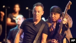 American performer Bruce Springsteen, left, performs during a soundcheck with band member Steven Van Zandt, right, before performing in Cape Town, South Africa, Jan. 26, 2014.