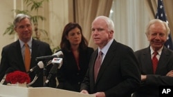 U.S. Senator John McCain (2nd R) speaks as Senators Joseph Lieberman, Sheldon Whitehouse (L) and Kelly Ayotte (2nd L) look on during a press briefing in Hanoi January 19, 2012, one of the stops on their visit to Asia.