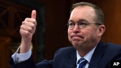 Budget director Mick Mulvaney testifies before the Senate Budget Committee on Capitol Hill in Washington, Feb. 13, 2018. The Trump administration is pushing a “bold new approach to nutrition assistance" — replacing the traditional cash on a card that food stamp recipients currently get with a pre-assembled box of canned foods and other shelf-stable goods dubbed “America’s Harvest Box.” 