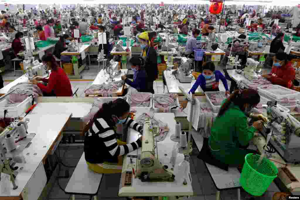 Employees work at a factory supplier of the H&amp;M brand in Kandal province, Cambodia.