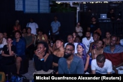 The audience listens to live poetry at "True Talk No Lie", a monthly spoken word event in Port of Spain, Trinidad and Tobago, May 23, 2018.