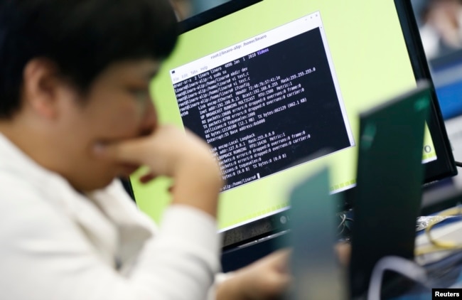 FILE - A student attends a white-hat hackers competition, co-hosted by the Defense Ministry and the National Intelligence Service, at the Korea Military Academy in Seoul, Sept. 29, 2013.