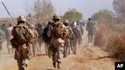 Des soldats américains dans la province afghane du Helmand, le 1er mars 2010. (AP Photo/Massoud Hossaini, Pool)