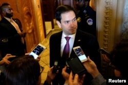 FILE - U.S. Sen. Marco Rubio speaks to reporters outside the Senate floor in Washington, July 17, 2018.