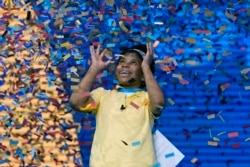 Zaila Avant-garde, 14, from Harvey, Louisiana is covered with confetti as she celebrates winning the finals of the 2021 Scripps National Spelling Bee July 8, 2021