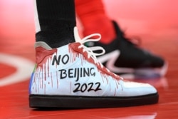 The shoes of Boston Celtics center Enes Kanter as seen during the first half of an NBA basketball game against the Washington Wizards, Oct. 30, 2021, in Washington.