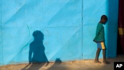 FILE - A boy who fled northern Mali is seen at a camp for internally displaced persons, about 620 kilometers north of Bamako, in the city of Sevare, Mali.