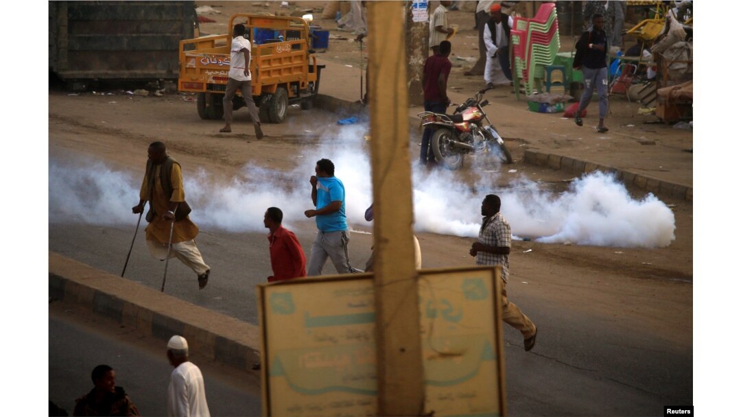 fILE - A tear gas canister fired to disperse Sudanese demonstrators, during anti-government protests in the outskirts of Khartoum, Sudan, Jan. 15, 2019.