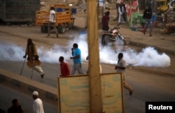 A tear gas canister fired to disperse Sudanese demonstrators, during anti-government protests in the outskirts of Khartoum, Sudan, Jan. 15, 2019.