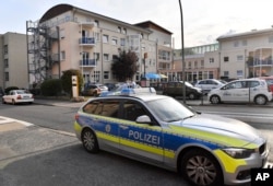 Police stand in front of a senior home in Ahlen, Germany, where Jakiw Palij, an accused former Nazi guard, arrived Aug. 21, 2018.