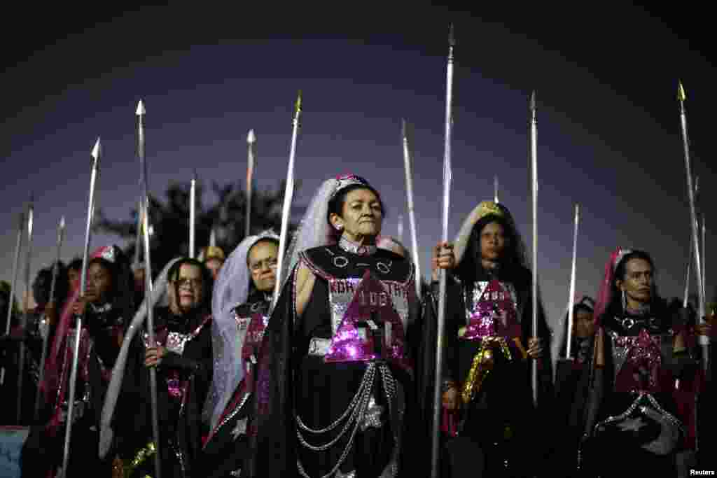 Worshipers attend the Day of the Spiritual Indoctrinator annual celebrations at the Vale do Amanhecer (Valley of the Dawn) community in the Planaltina neighborhood of Brasilia, Brazil. The Vale do Amanhecer is a Christian Spiritualistic doctrine founded by the spiritualist visionary known as Tia Neiva (Aunt Neiva) in 1958 in Brazil&#39;s Federal District.