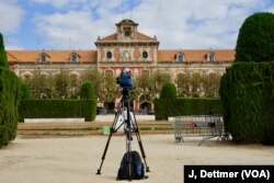 No news: TV camera crews parked outside the Catalan parliament have had long periods of downtime waiting for dramatic developments in the stop-start standoff between Barcelona and Madrid.