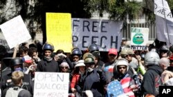 FILE - A crowd gathers around speakers during a rally for free speech, April 27, 2017, in Berkeley, Calif. 