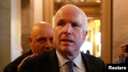 U.S. Senator John McCain (R-AZ) leaves after Senator Dianne Feinstein's (D-CA) speech on the Senate floor on Capitol Hill, in Washington, Dec. 9, 2014.