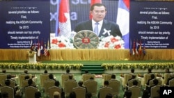 Cambodia's Prime Minister Hun Sen delivers his opening speaks for the 21st Association of Southeast Asian Nations or ASEAN Summit in Phnom Penh, Cambodia, Sunday, Nov. 18, 2012. 