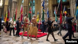 Flags of the Commonwealth being paraded through the Abbey at the Commonwealth Service at Westminster Abbey in London, March 12, 2018.