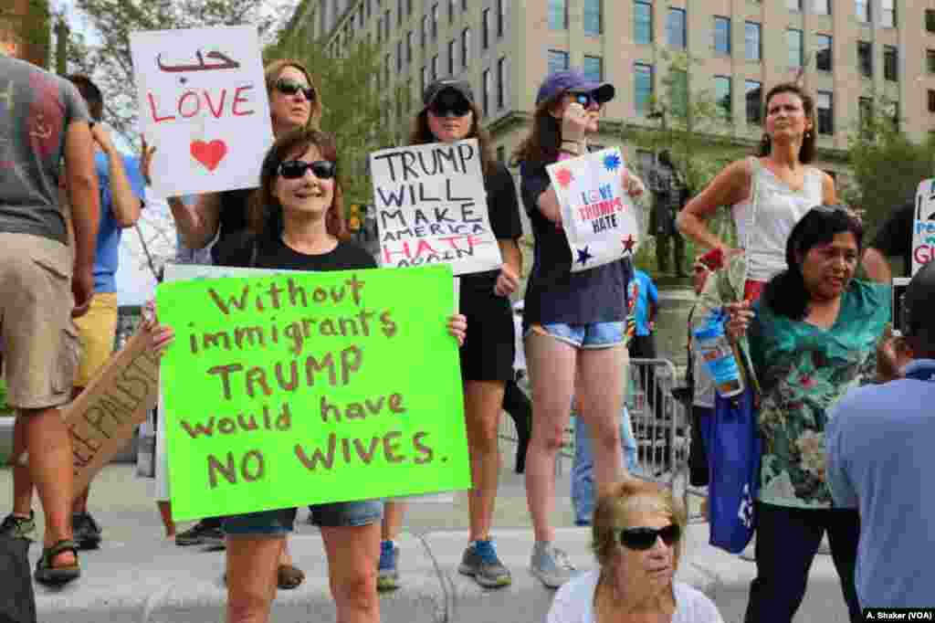 An anti-Trump protester holds a sign during the Republican National Convention in Cleveland, Ohio, U.S